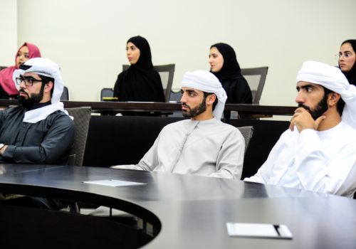 Postgraduate students paying attention in class