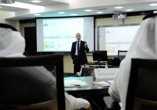 Postgraduate students attending a course lecture