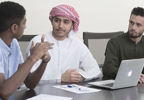 University scholarship – Group of students discussing ideas for a project