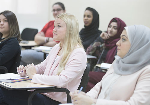 Academic scholarship – Students listening to a lecture in class